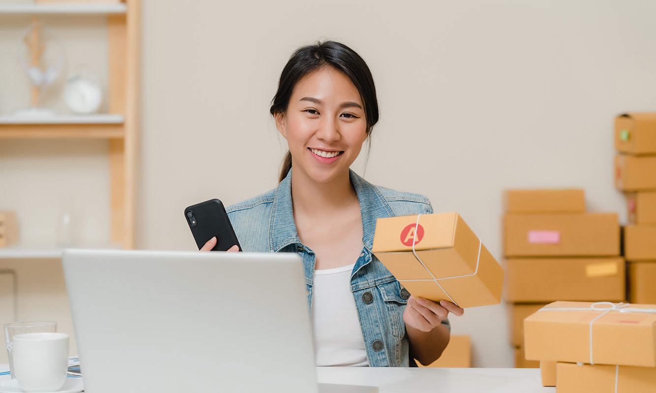 beautiful-smart-asian-young-entrepreneur-business-woman-owner-sme-checking-product-stock-scan-qr-code-working-home (1)